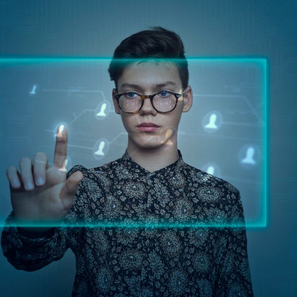 Man cracking a computer code in the dark